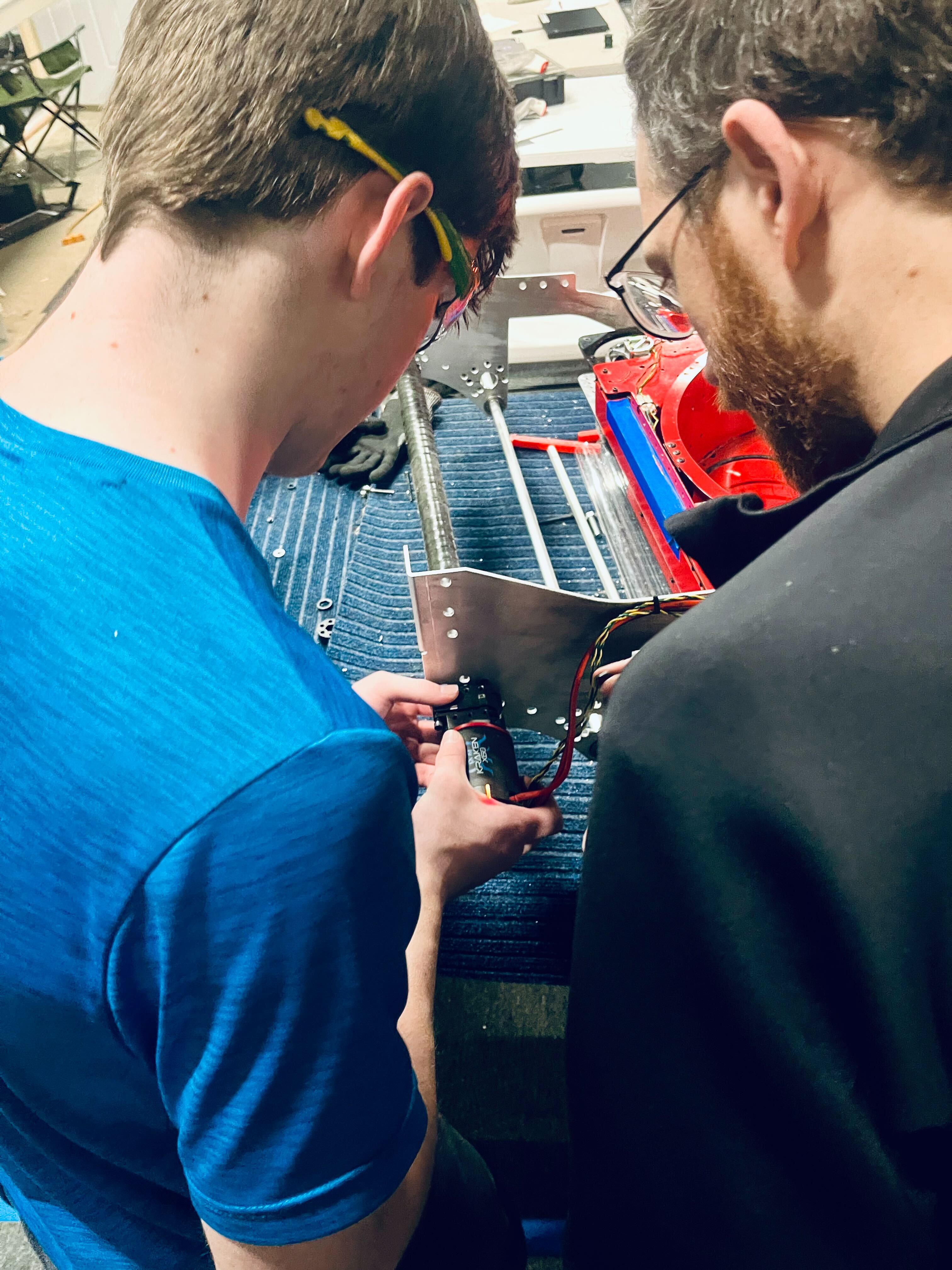 Student examines motor